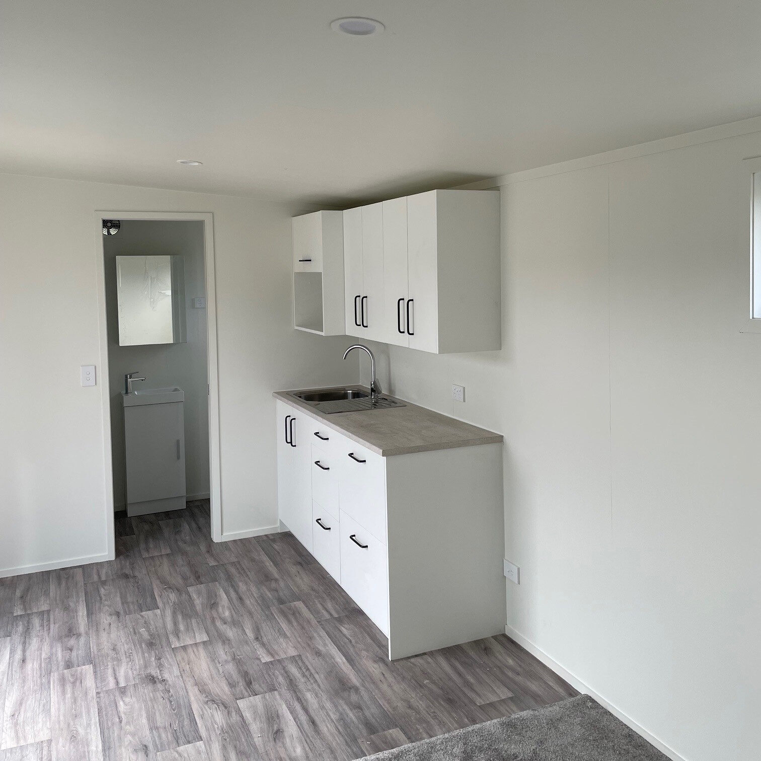 Self-contained cabin kitchenette bathroom